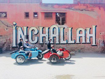 Vintage motorcycle with sidecar parked on a Marrakech street