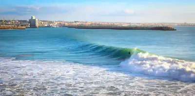 Surfer riding a wave at Taghazout