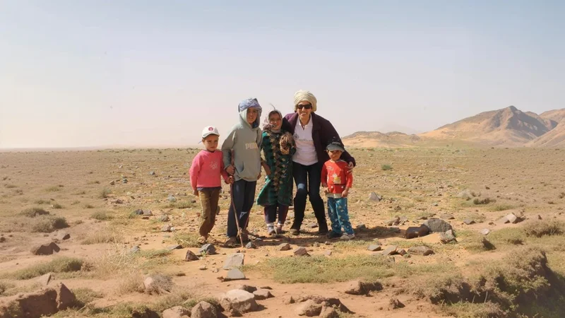 Siroco Tours team with local children in the Moroccan desert