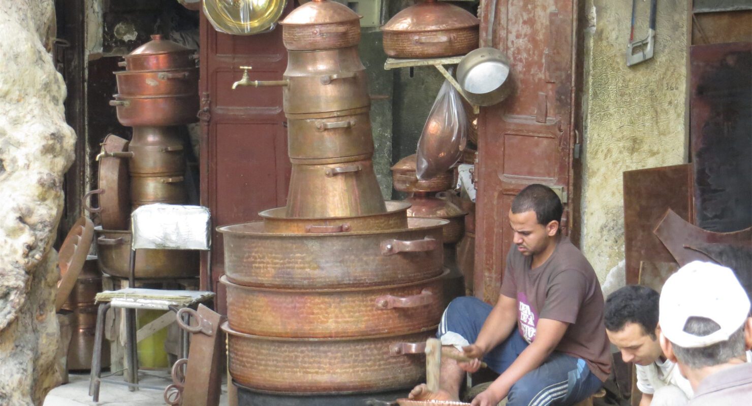 Copper and brassware displayed in a Fes medina workshop