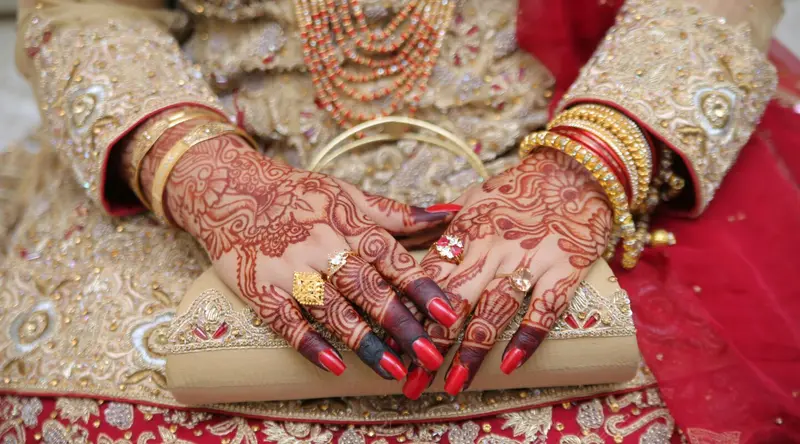 Intricate henna patterns painted on a hand