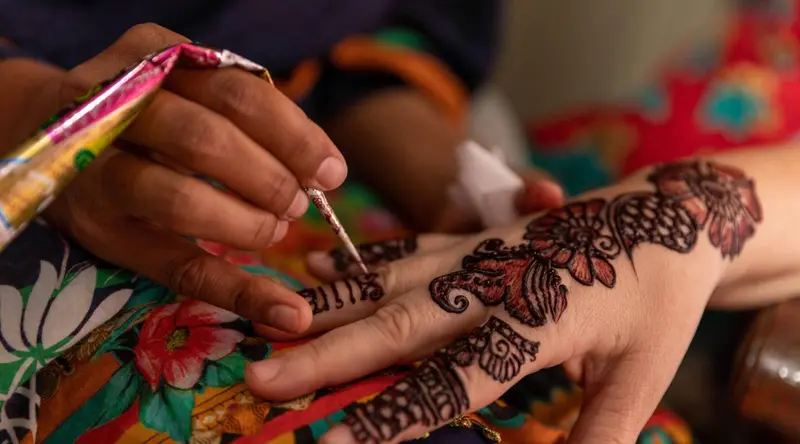 Intricate henna patterns painted on a hand