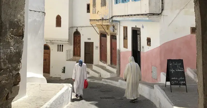 Two Moroccan men wear white Djellaba