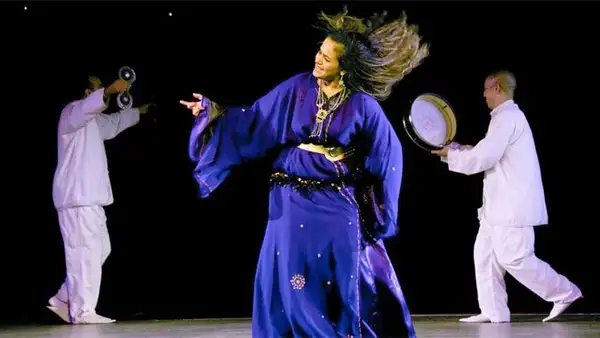 Performers in traditional dress during a Moroccan folk dance