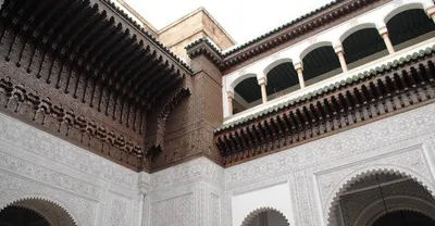 Horseshoe arches and carved plaster inside a Moroccan palace