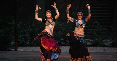 Performers in traditional dress during a Moroccan folk dance