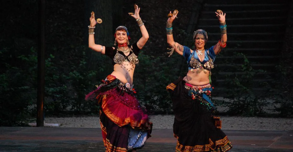 Performers in traditional dress during a Moroccan folk dance