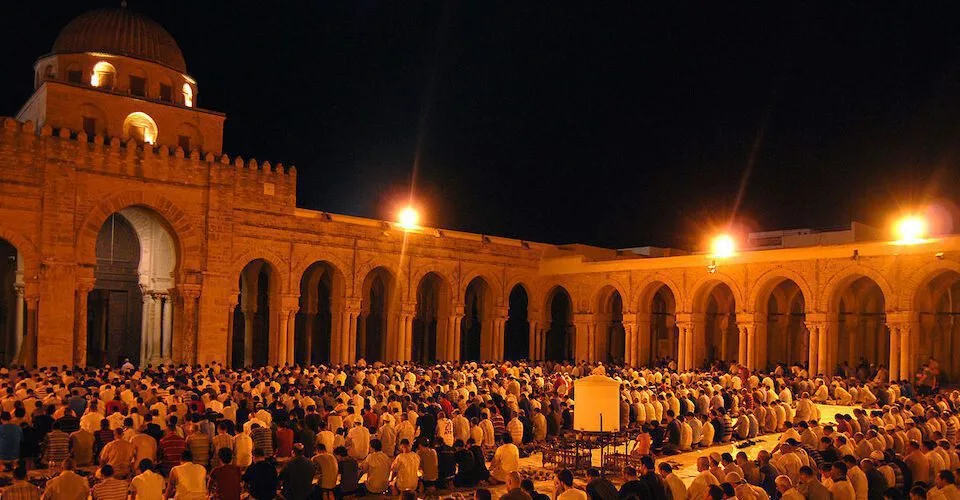 Lanterns glowing in a medina street during Ramadan evenings