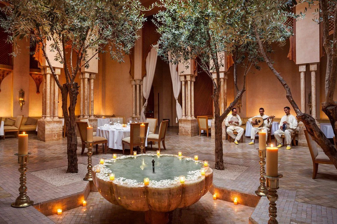 Candlelit Moroccan restaurant terrace with lanterns and dining tables