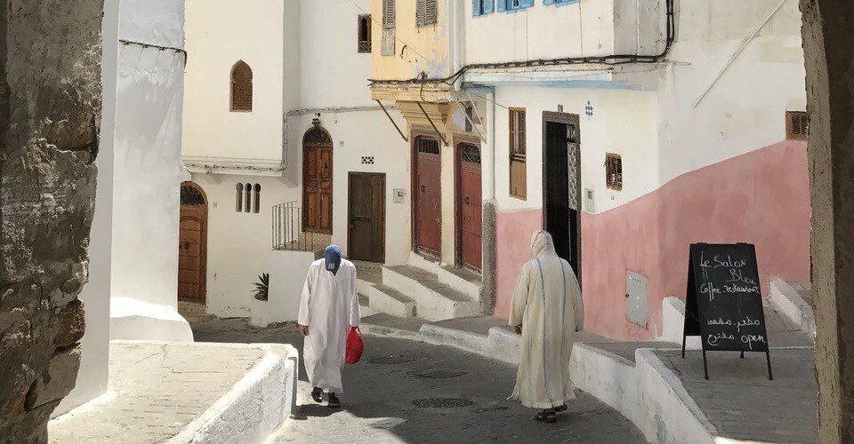 Two Moroccan men wear white Djellaba