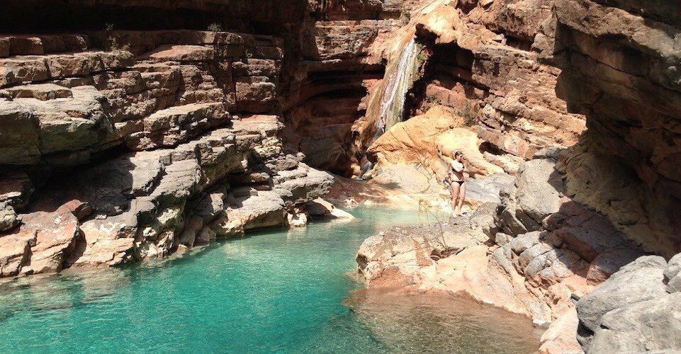 Small waterfall falls into the lake