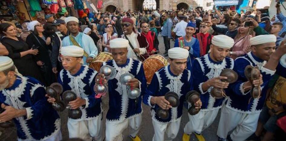 People wear tradition customs play Moroccan music
