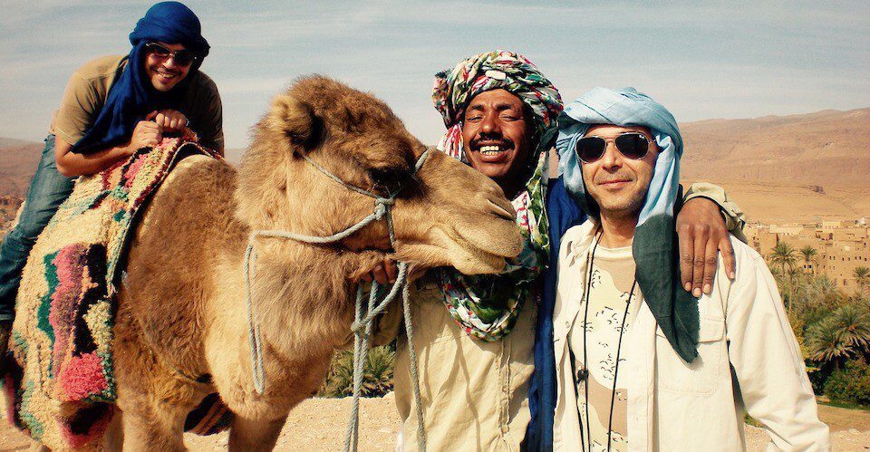 Berber man with foreign traveler