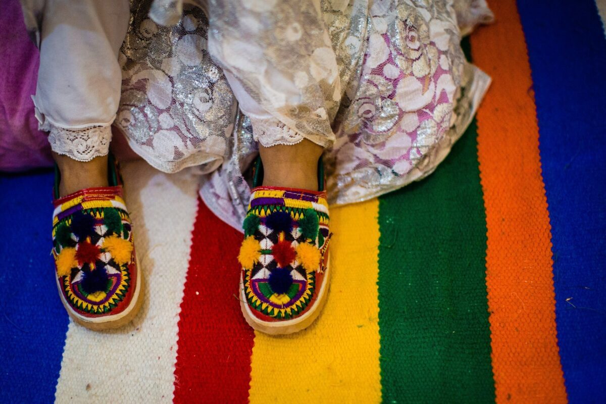 Cute baby wears traditional shoes